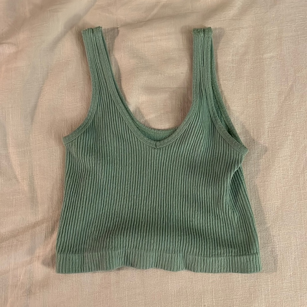 Green out from under tank top